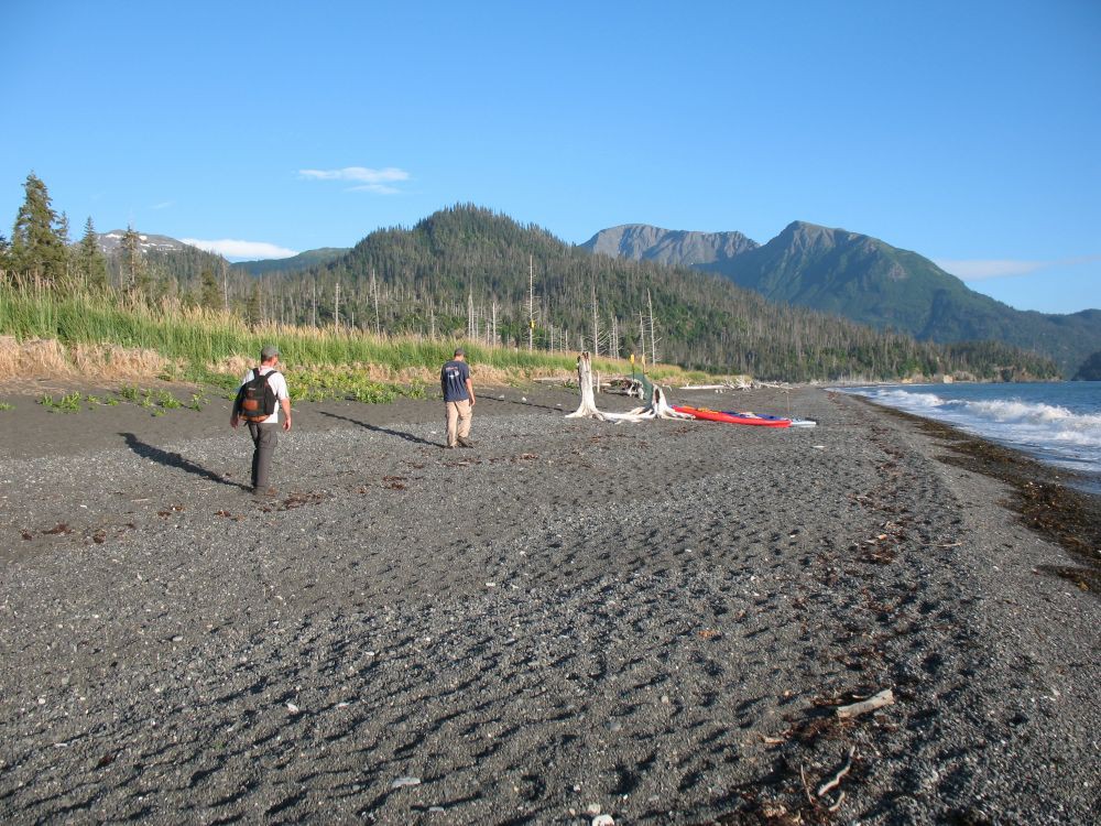 Hikers landing on the beach at the Glacier Spit trailhead
