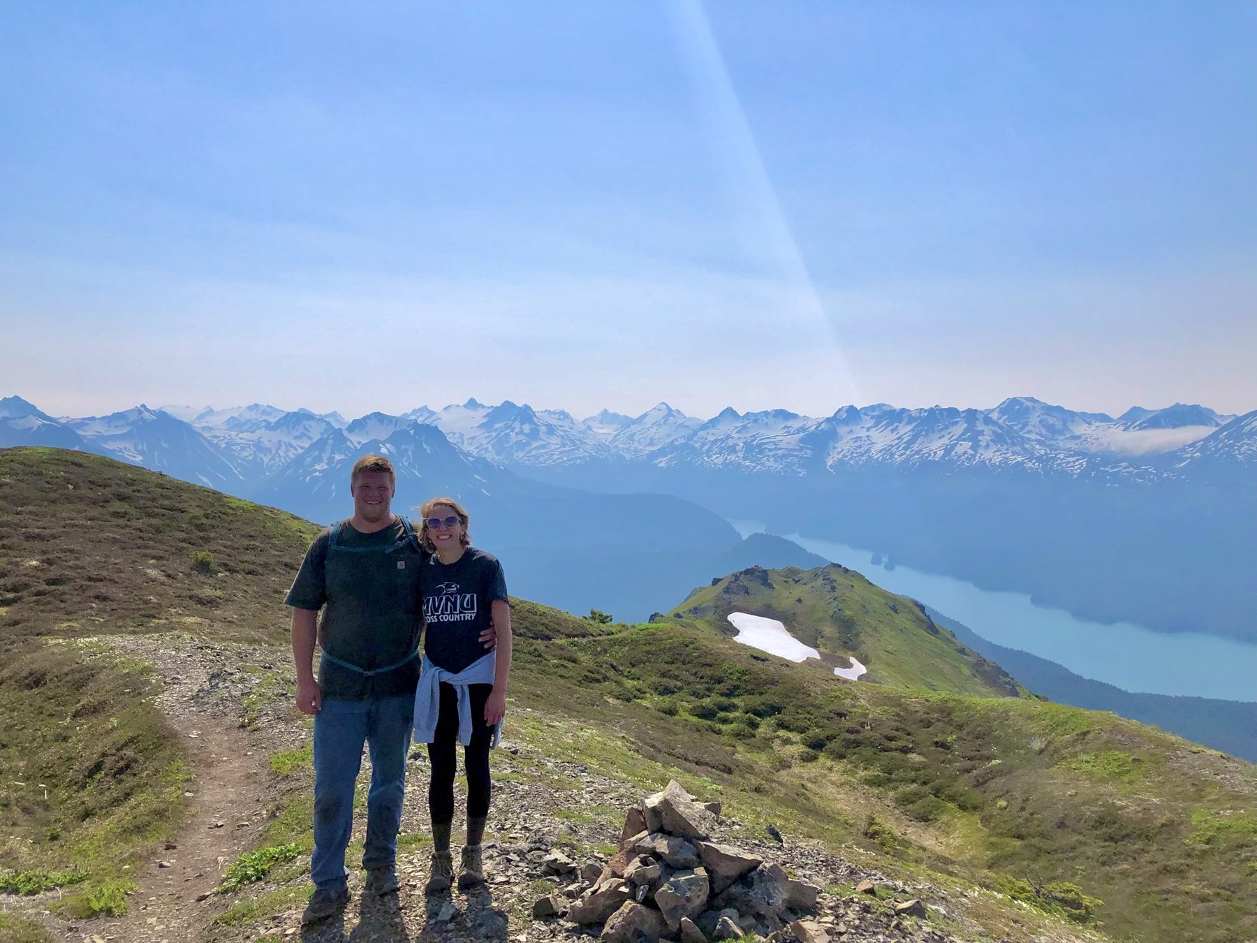 Hikers taking in panoramic views from the Grace Ridge summit