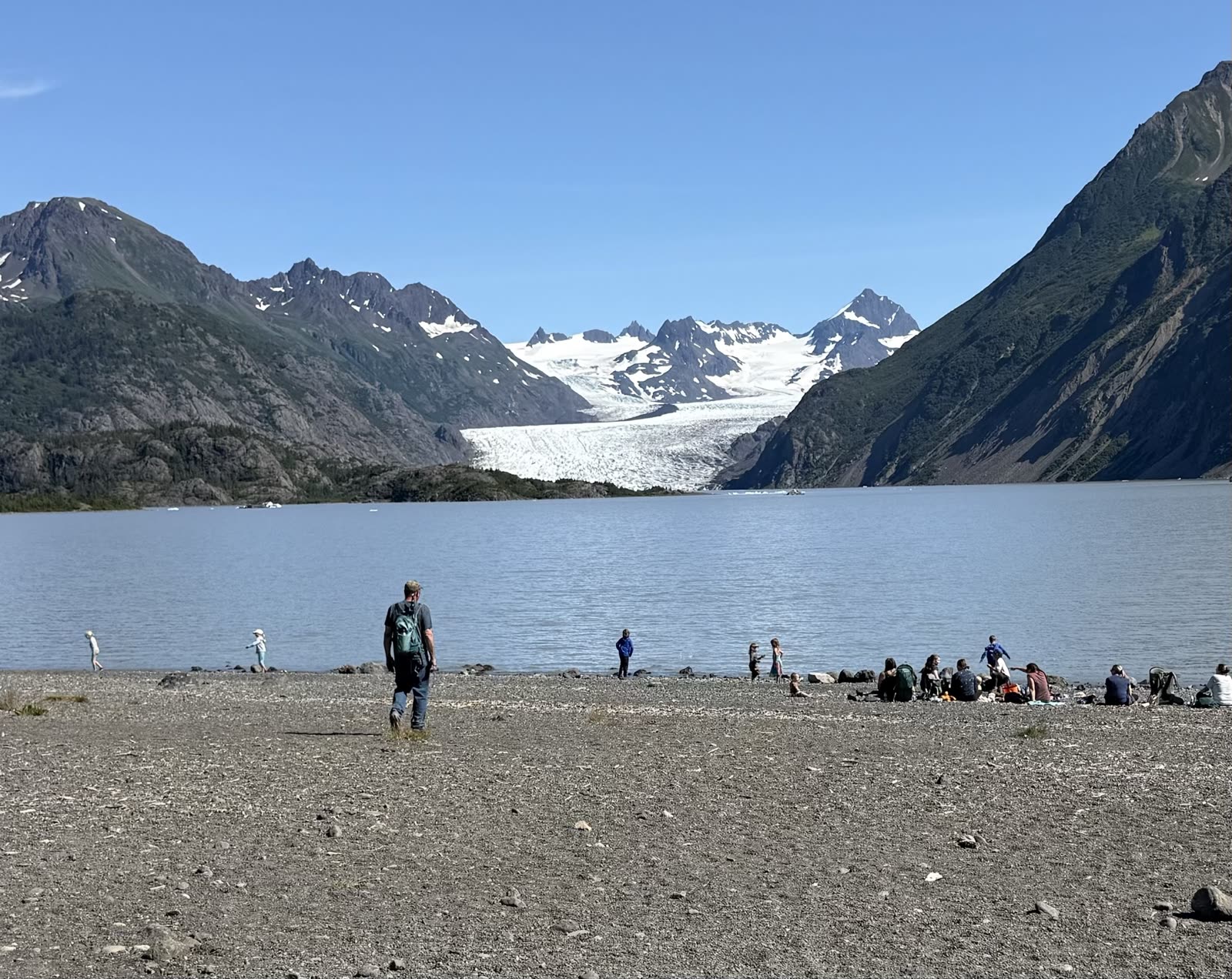 Grewingk Glacier Lake with icebergs and the glacier face visible in the distance