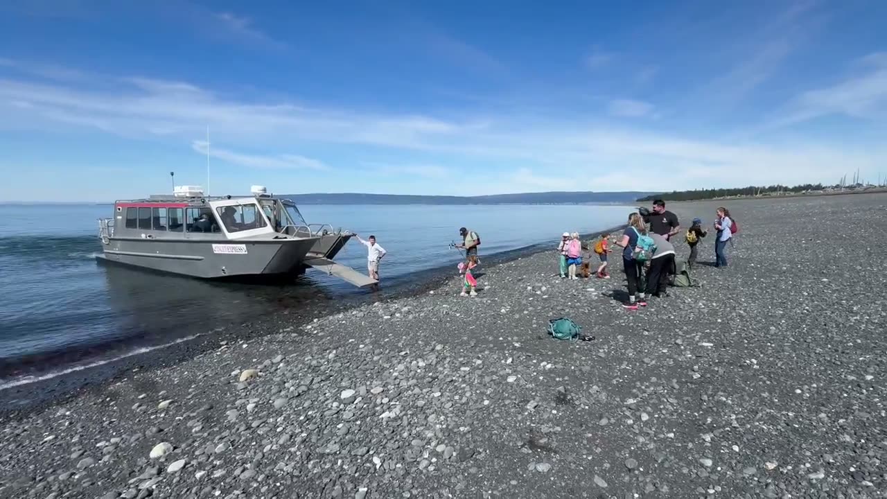 M/V Inlet Express landing on the gravel beach at Glacier Spit with hikers offloading
